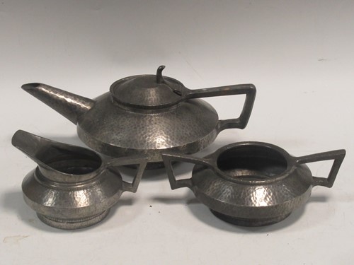 Lot 48 - An Art Deco style pewter three-piece tea tea set