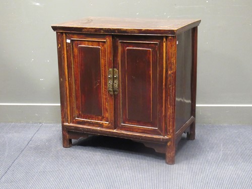 Lot 478 - A South East Asian two door stained wood side...