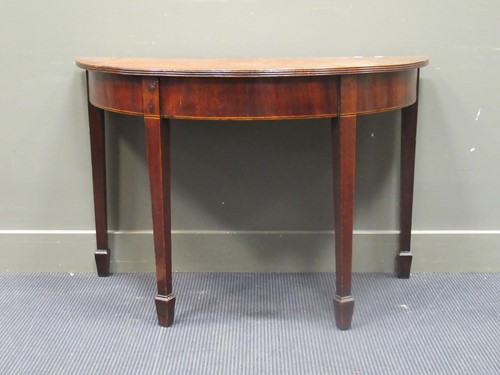 Lot 535 - A George III demilune side table, 71 high 76 wide