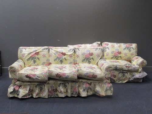Lot 501 - Two sofas, covered in floral fabric by Jean...