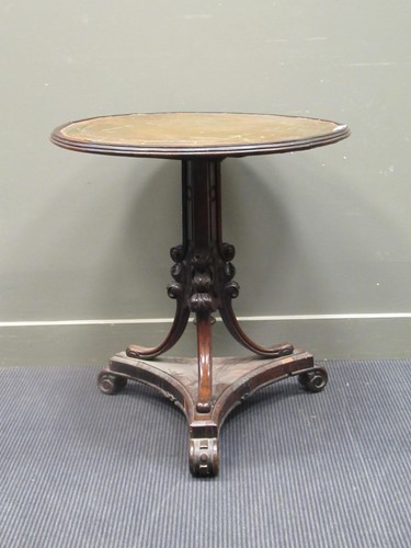 Lot 426 - A Victorian leather topped circular table, 76...