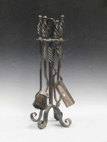 Lot 541 - A blacksmith made set of fireside tools