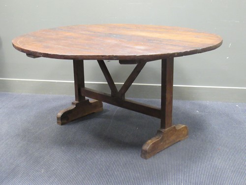 Lot 419 - A French circular tip up top supper table on...