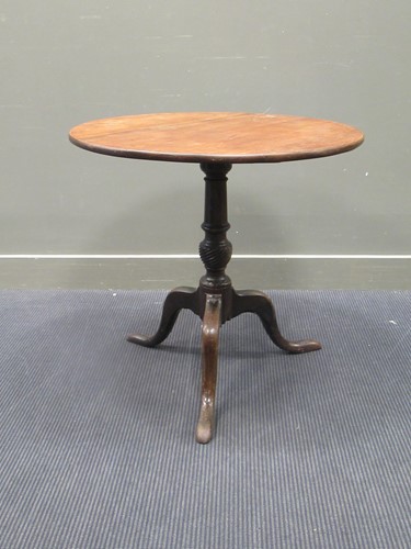 Lot 430 - A 19th Century mahogany circular tilt up top...
