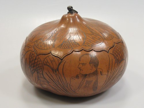Lot 74 - A gourd carved with a head portrait of...