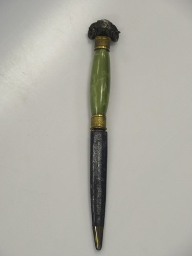 Lot 64 - An onyx handle letter knife with bronze rams...