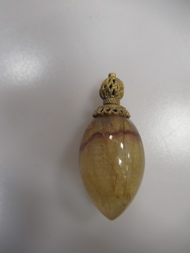 Lot 62 - A miniature hard stone egg-shape scent bottle,...