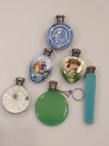 Lot 65 - Four silver capped scent bottles, including...