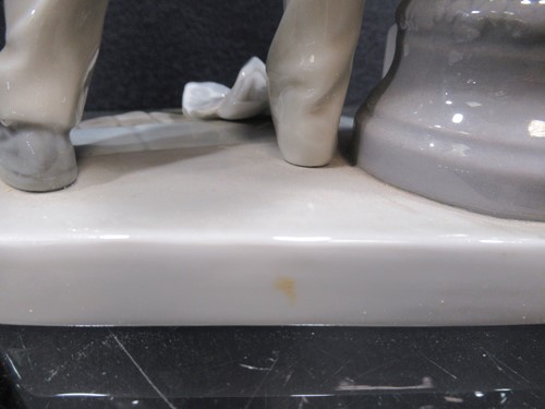 Lot 78 - A Lladro figure of a lamplighter 46cm high and...