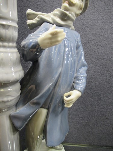 Lot 78 - A Lladro figure of a lamplighter 46cm high and...