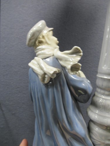 Lot 78 - A Lladro figure of a lamplighter 46cm high and...