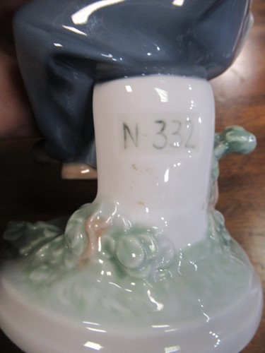 Lot 78 - A Lladro figure of a lamplighter 46cm high and...