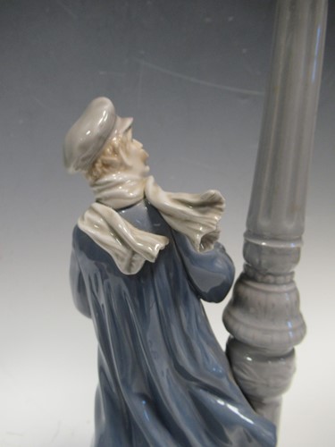 Lot 78 - A Lladro figure of a lamplighter 46cm high and...