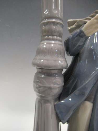 Lot 78 - A Lladro figure of a lamplighter 46cm high and...