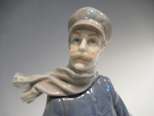 Lot 78 - A Lladro figure of a lamplighter 46cm high and...