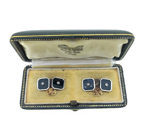 Lot 33 - A pair of onyx and diamond cufflinks