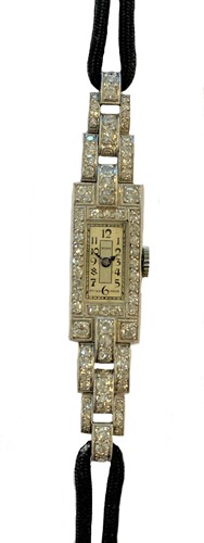 Lot 326 - Tiny - A platinum diamond set Art Deco  cocktail watch