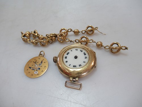 Lot 201 - An 18ct gold watch head, weight 16g, together...
