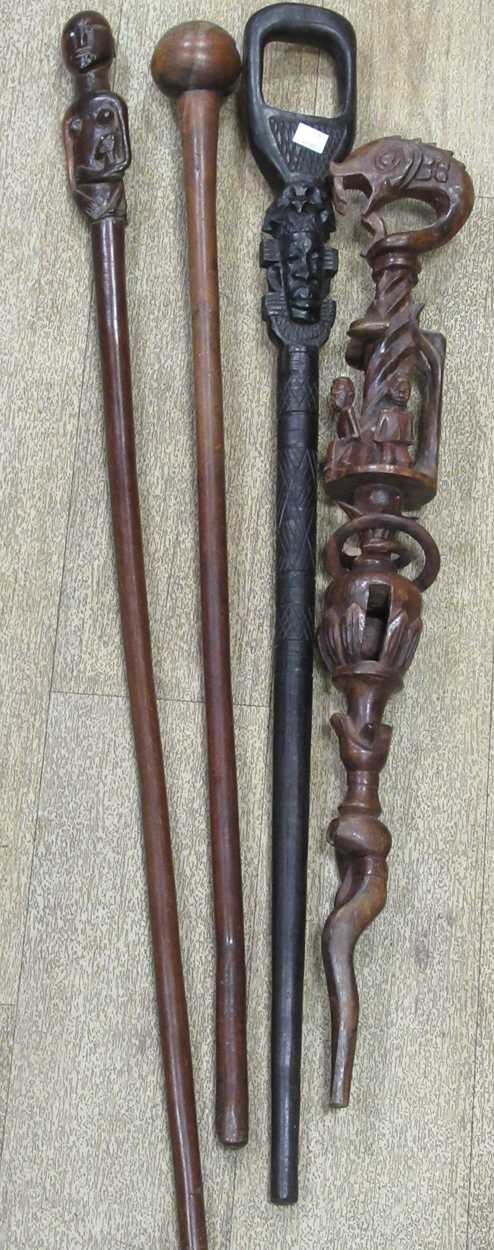 Lot 137 - A collection of carved african canes and...