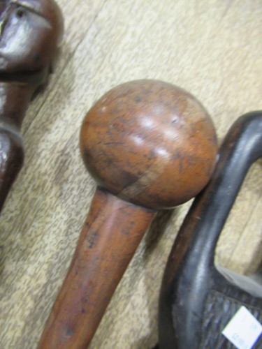 Lot 137 - A collection of carved african canes and...