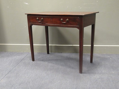 Lot 453 - A George III mahogany sidetable, the oak lined...