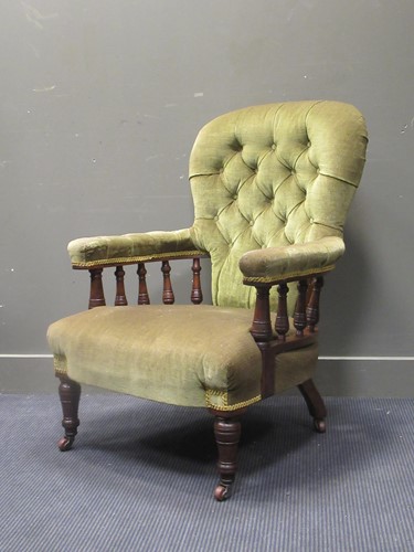 Lot 557 - Circa 1860 a walnut green button back armchair,...