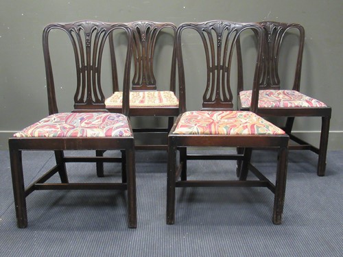 Lot 485 - A set of four George III mahogany chairs with...