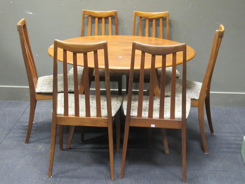 Lot 460 - A drop leaf Ercol table together with a set of...