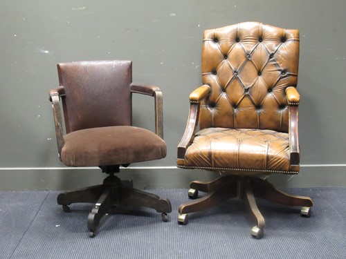 Lot 457 - Two leather swivel office chairs both...