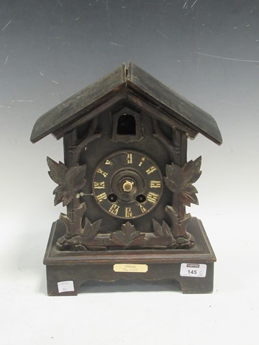 Lot 145 - A Black Forest clock with a plaque dating 1880,...