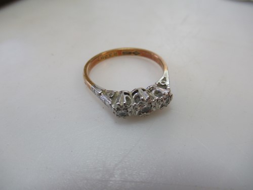 Lot 193 - A three stone diamond ring, estimated...