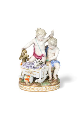 Lot 421 - A Meissen group of two putti with a monkey and a crib, late 19th/early 20th century