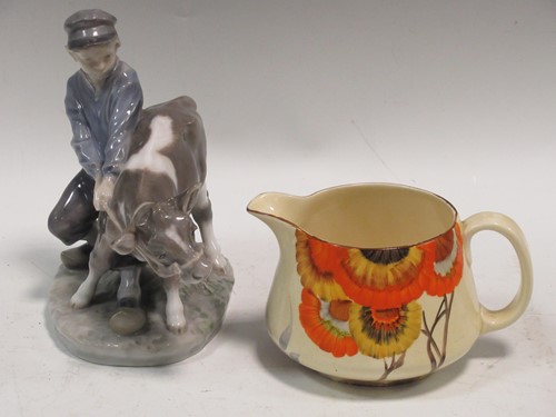 Lot 3 - A Royal Copenhagen boy with a cow together...