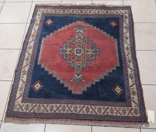 Lot 592 - A hand-knotted Kazak style rug, circa 1950
