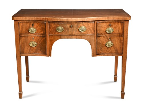 Lot 302 - A George III mahogany serpentine fronted sideboard