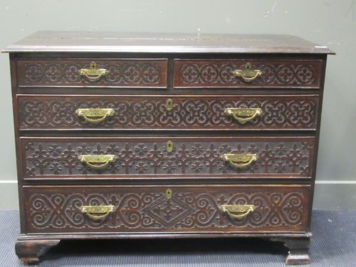 Lot 442 - A 19th century oak chest of drawers with blind...