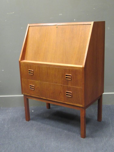 Lot 563 - A 20th century teak bureau, the fall front...