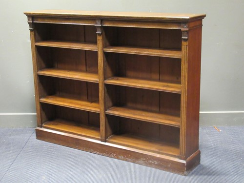 Lot 564 - A late Victorian oak open bookcase with...