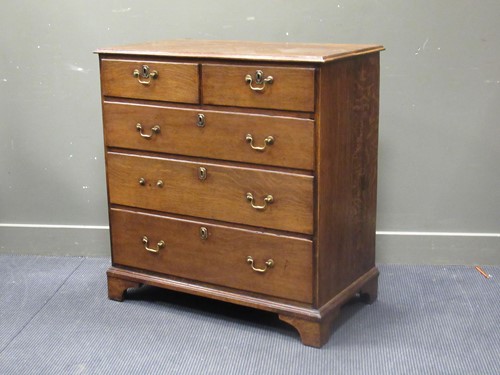 Lot 567 - A 19th century oak chest of two short over...