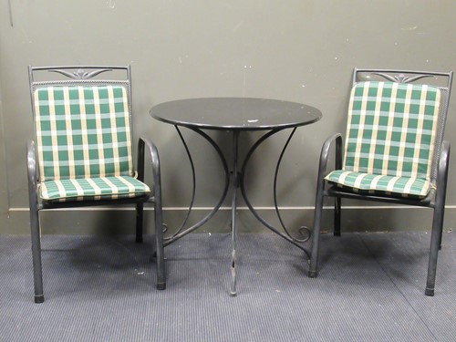 Lot 576 - A small granite topped garden table and two...