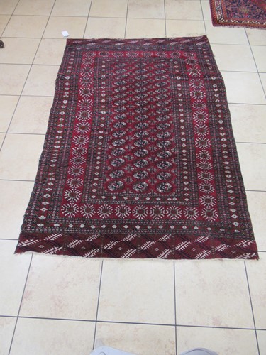 Lot 602 - A red ground Bokhara rug 240 x 159cm
