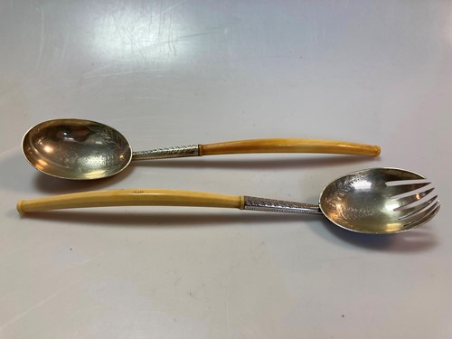 Lot 211 - A pair of Victorian silver salad servers with...