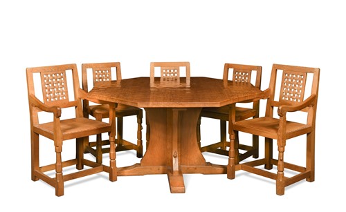 Lot 137 - Robert 'Mouseman' Thompson, an oak dining table and eight chairs