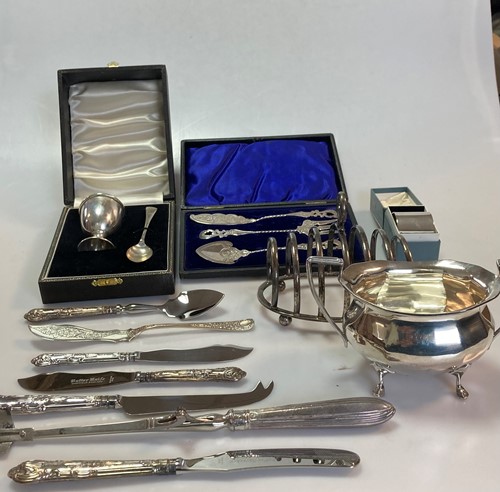 Lot 263 - A silver sugar bowl, a silver toast rack, a...