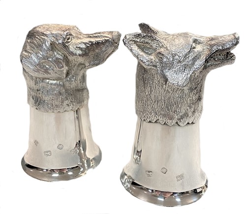 Lot 385 - A pair of 20th century part cast silver stirrup cups