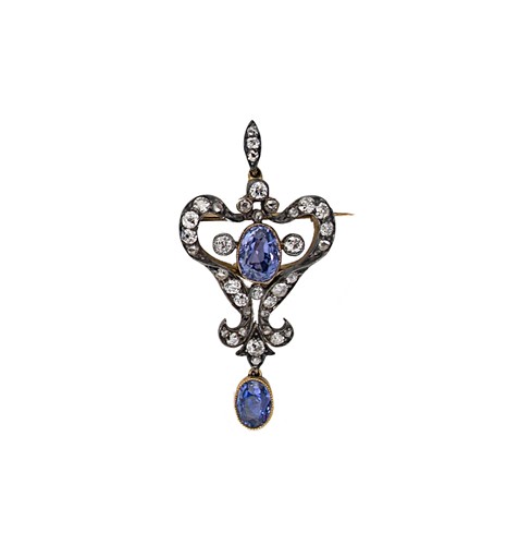 Lot 173 - An Art Nouveau sapphire and diamond pendant/brooch