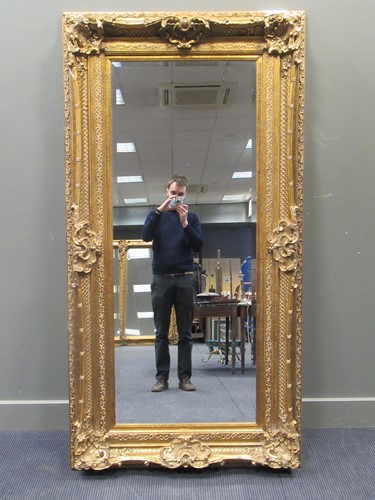 Lot 512 - A large gold painted wall mirror, 98 x 190cm