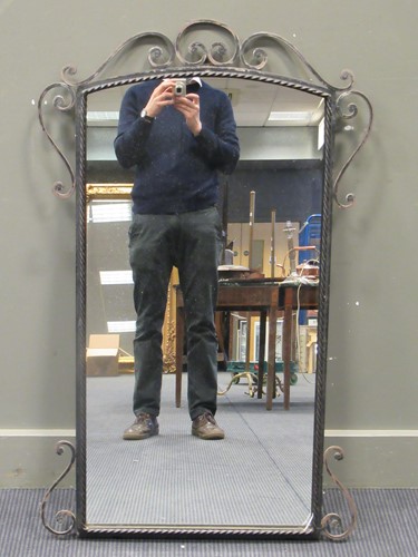 Lot 544 - A 20th century wrought iron frame mirror, 111...