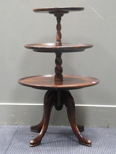 Lot 580 - A mahogany three tier dumb waiter with barley...