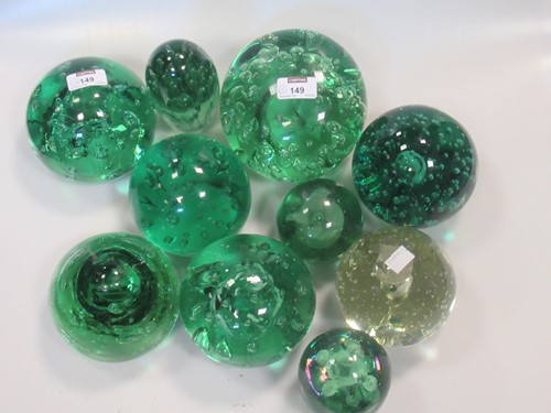 Lot 149 - Fifteen mainly Victorian glass dumps/paper...